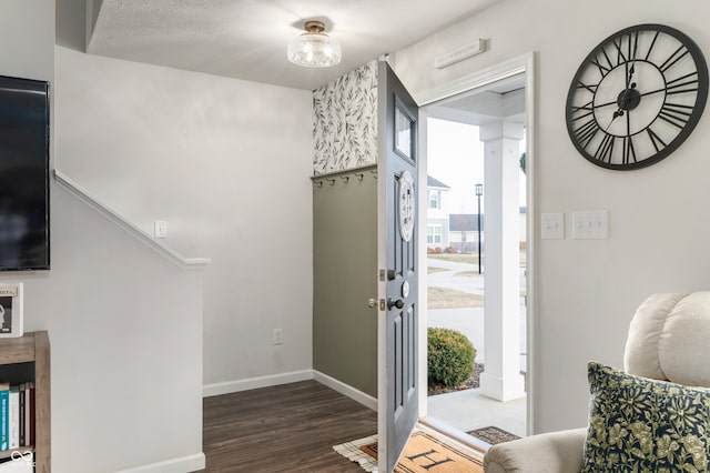 entryway with dark wood-type flooring