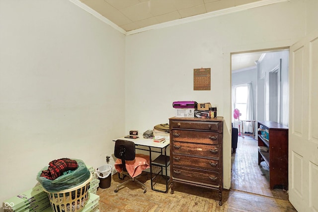 office area featuring ornamental molding and light hardwood / wood-style floors