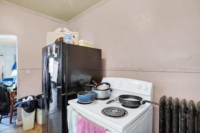 kitchen featuring black fridge, white electric range oven, and crown molding