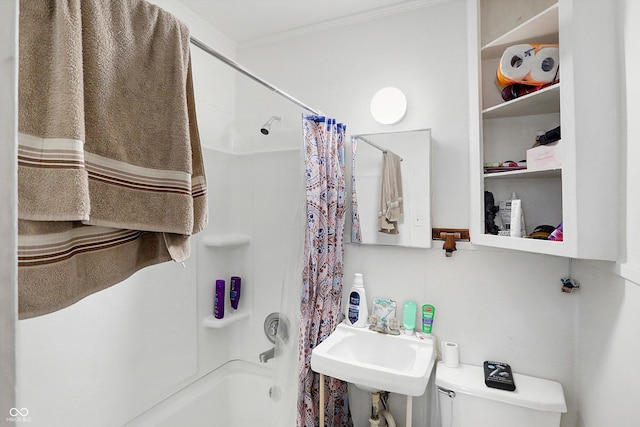 full bathroom with crown molding, sink, shower / tub combo, and toilet