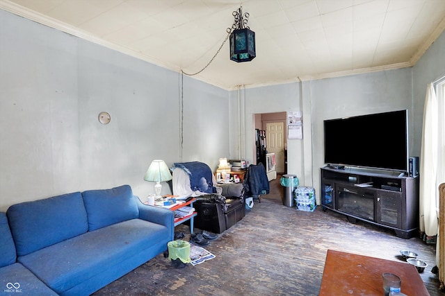 living room featuring hardwood / wood-style floors and crown molding