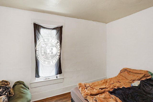 bedroom with hardwood / wood-style floors