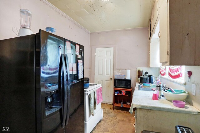 kitchen featuring washer / dryer and black appliances