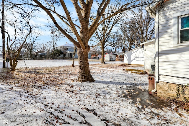 view of yard layered in snow