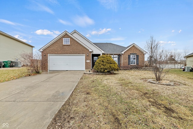 traditional-style home featuring driveway, a garage, brick siding, central AC, and a front yard