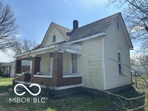 view of side of property with a porch