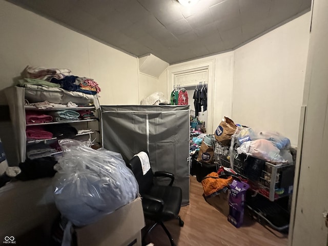 bedroom with hardwood / wood-style flooring and a closet