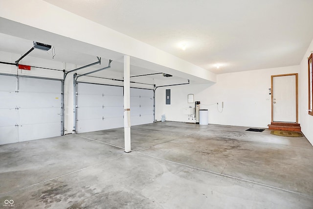 garage featuring a garage door opener and electric panel