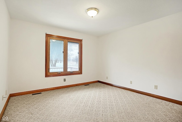 spare room with carpet floors