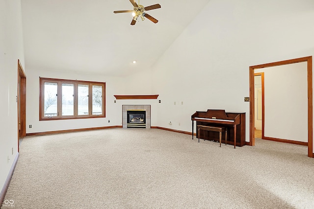 unfurnished living room featuring ceiling fan, a tile fireplace, high vaulted ceiling, and light carpet