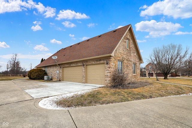 view of property exterior featuring a garage and central air condition unit