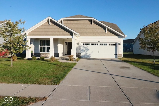 craftsman-style house featuring a front lawn, a porch, and a garage