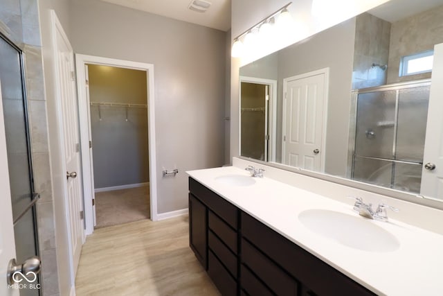 bathroom with vanity and walk in shower