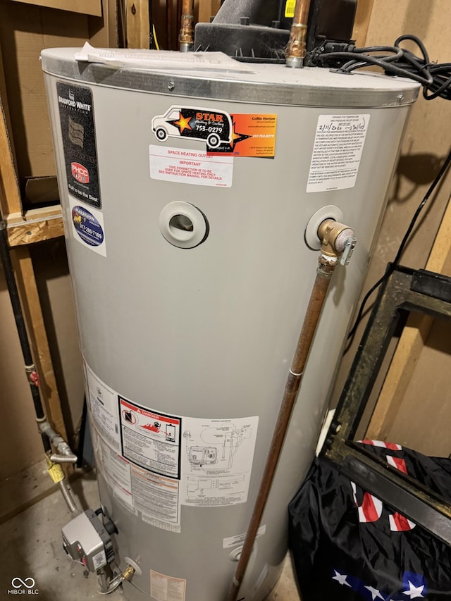 utility room featuring gas water heater