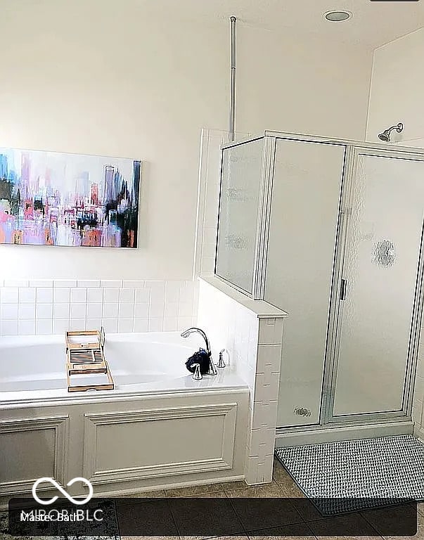 bathroom featuring tile patterned floors and plus walk in shower