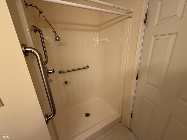 bathroom featuring tile patterned flooring and walk in shower