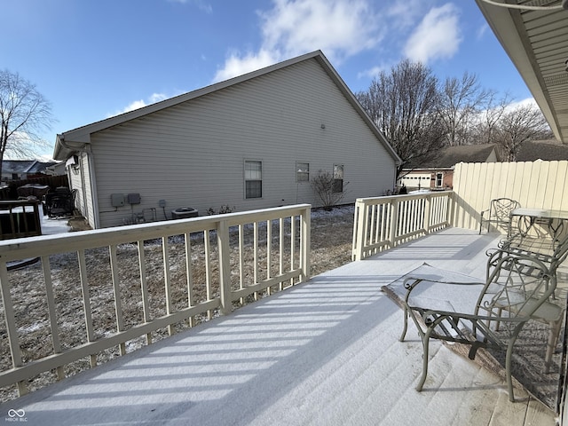 wooden terrace featuring fence