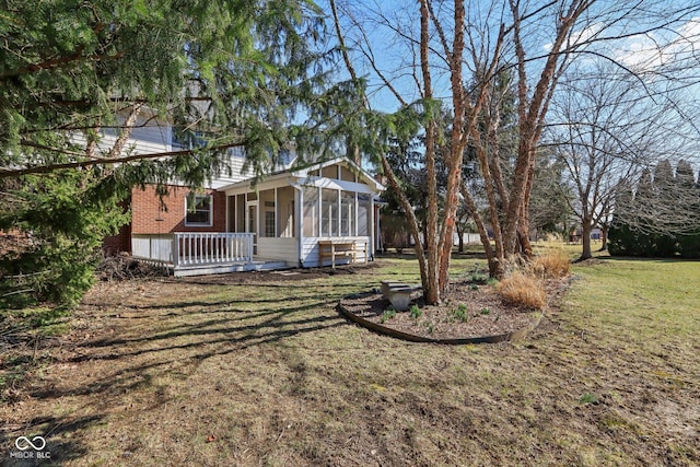 view of yard with a sunroom