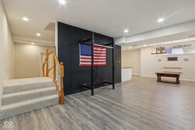 recreation room featuring recessed lighting, baseboards, and wood finished floors