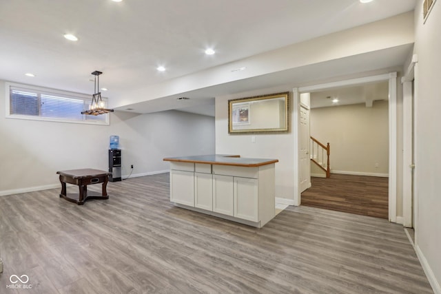 kitchen featuring recessed lighting, light wood-type flooring, and baseboards