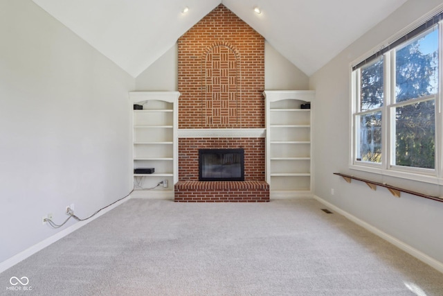 unfurnished living room featuring carpet, lofted ceiling, a fireplace, and baseboards