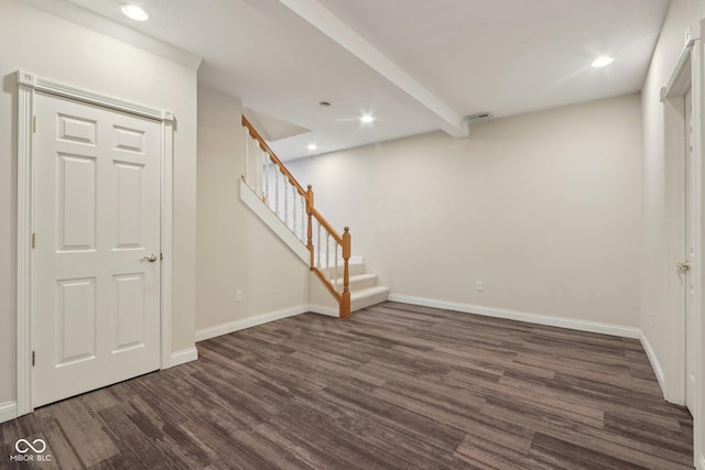 below grade area with stairway, recessed lighting, baseboards, and dark wood-style flooring