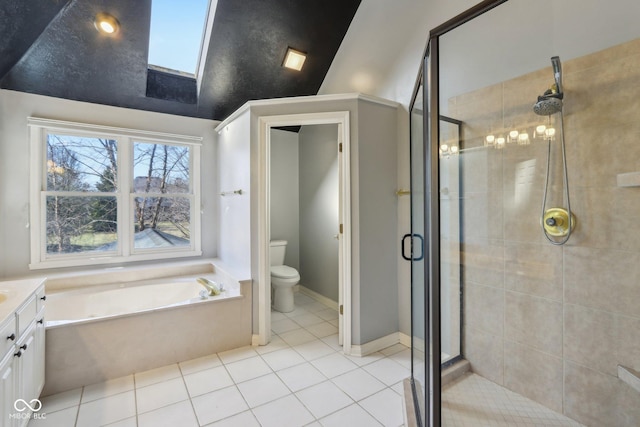 bathroom with vanity, a bath, tile patterned flooring, a shower stall, and toilet