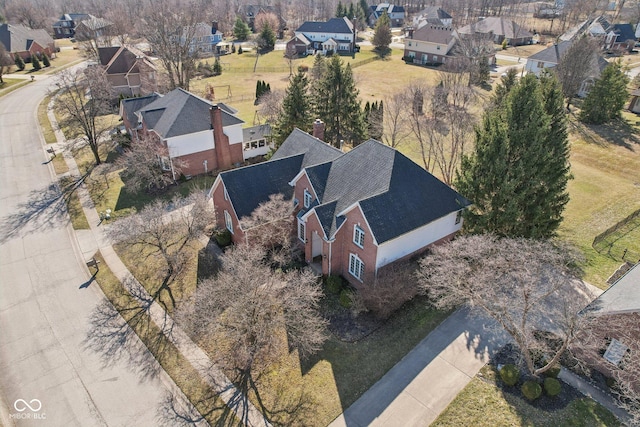 birds eye view of property with a residential view