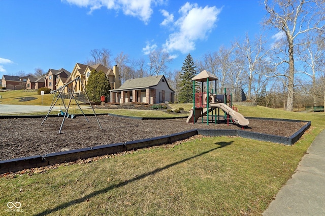 community jungle gym featuring a yard