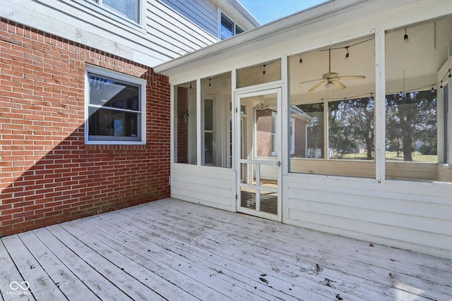 wooden terrace featuring a sunroom