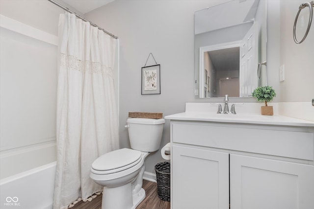 full bath featuring vanity, shower / bath combination with curtain, wood finished floors, and toilet