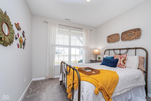 bedroom featuring carpet, visible vents, and baseboards