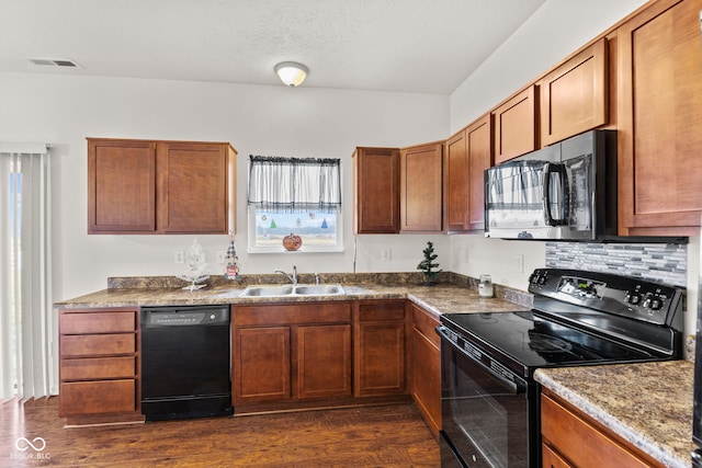 kitchen featuring backsplash, dark hardwood / wood-style flooring, sink, and black appliances