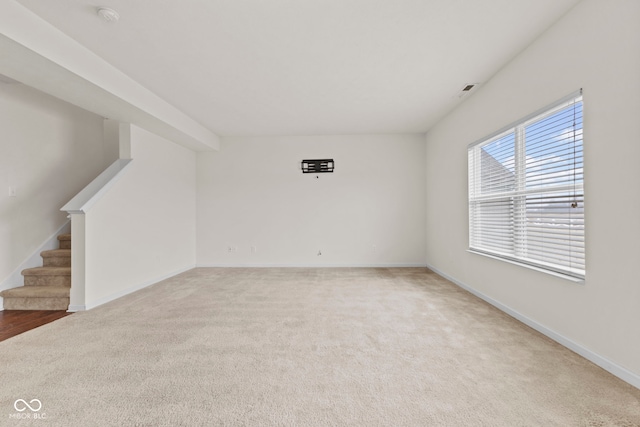 unfurnished room with carpet flooring