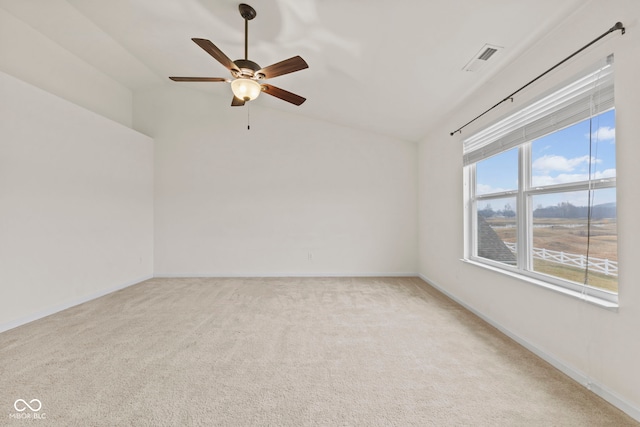 carpeted empty room with lofted ceiling and ceiling fan