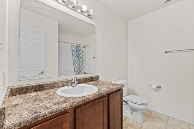 bathroom with vanity, toilet, and walk in shower