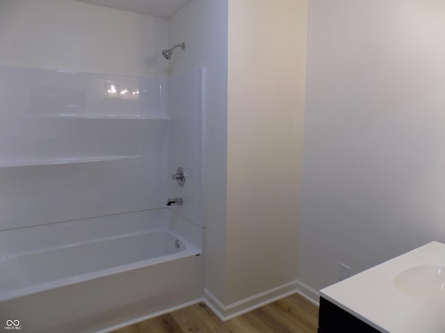 bathroom with vanity, shower / tub combination, and wood-type flooring