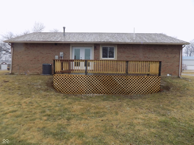 back of house featuring cooling unit, a yard, french doors, and a wooden deck