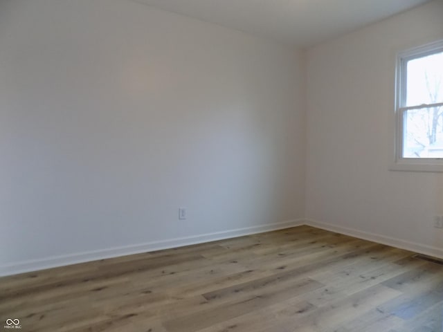 unfurnished room with light hardwood / wood-style floors