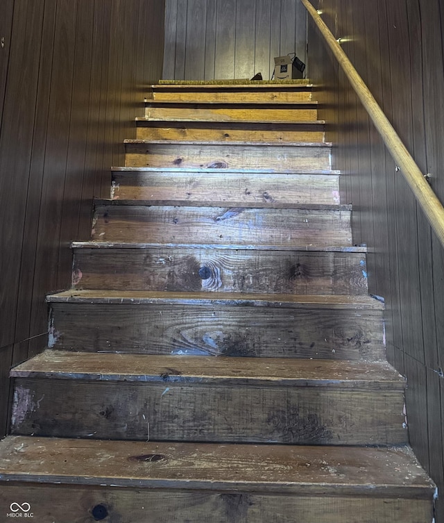 stairs with wood walls