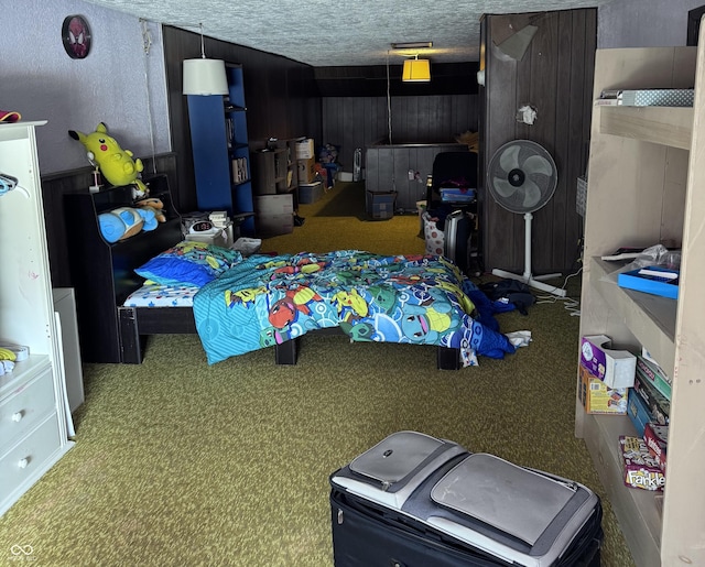 bedroom featuring carpet floors and a textured ceiling