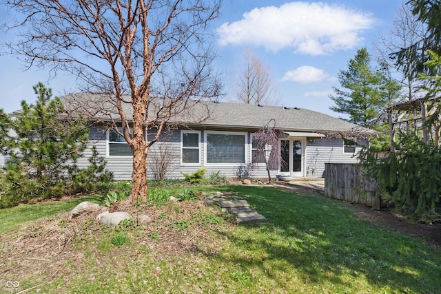 back of property with a yard