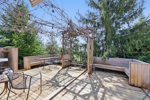 wooden deck with outdoor dining space