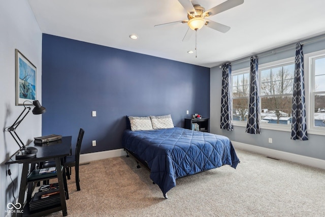 bedroom with ceiling fan, carpet, visible vents, and baseboards