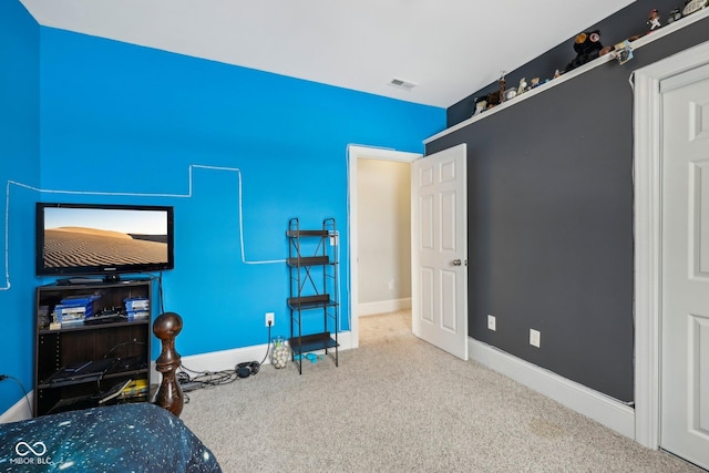 bedroom with baseboards, visible vents, and carpet flooring