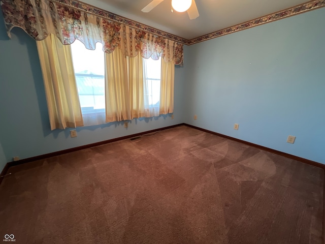 carpeted empty room with ceiling fan