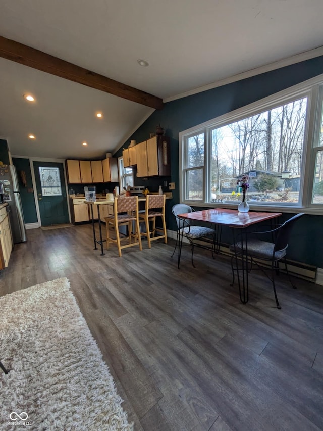 dining space featuring a baseboard heating unit, vaulted ceiling with beams, and dark hardwood / wood-style floors