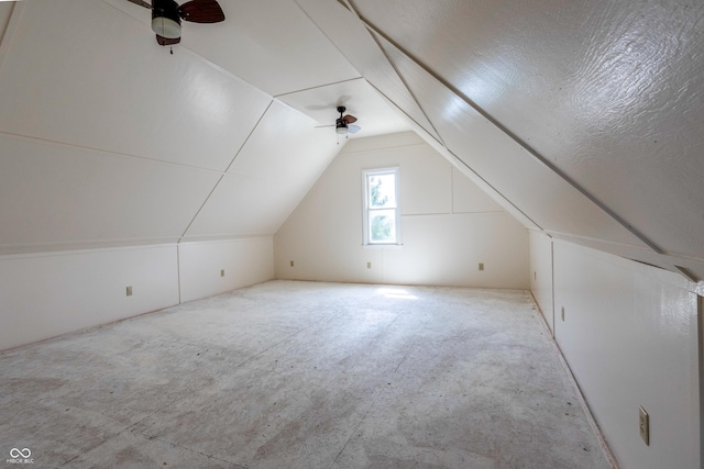 additional living space featuring ceiling fan, carpet, and lofted ceiling
