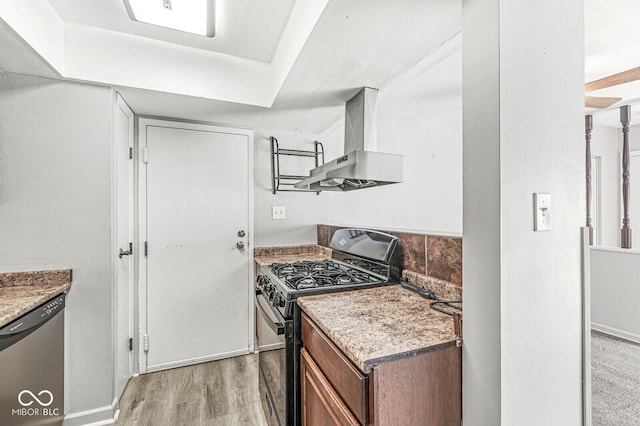 kitchen featuring black range with gas cooktop, stainless steel dishwasher, light wood-type flooring, brown cabinets, and island exhaust hood