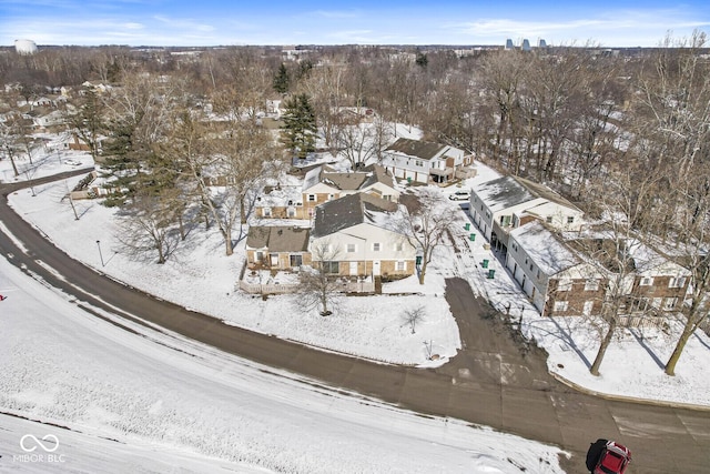 snowy aerial view featuring a residential view